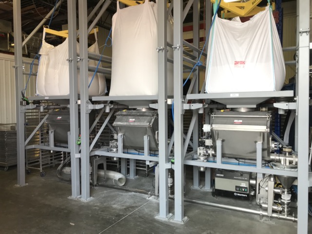 Fresh pizza dough balls portioned on tray